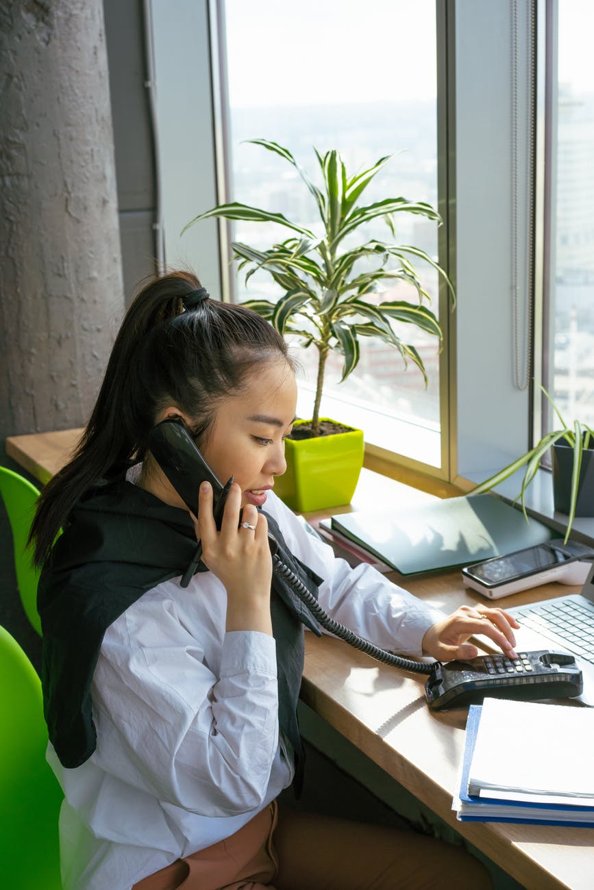 photo of a woman talking on the telephone